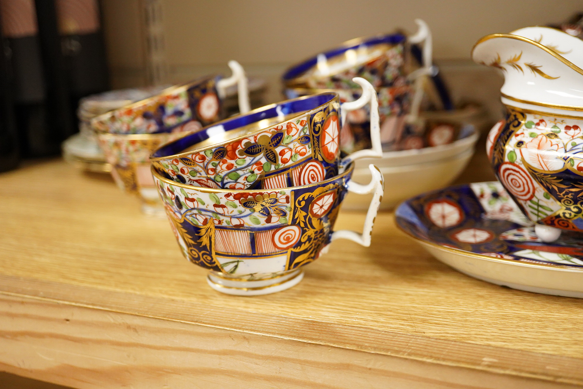 A 19th century Derby Imari pattern part tea set including a teapot a pair of 19th century botanical dishes and six small ironstone dishes.